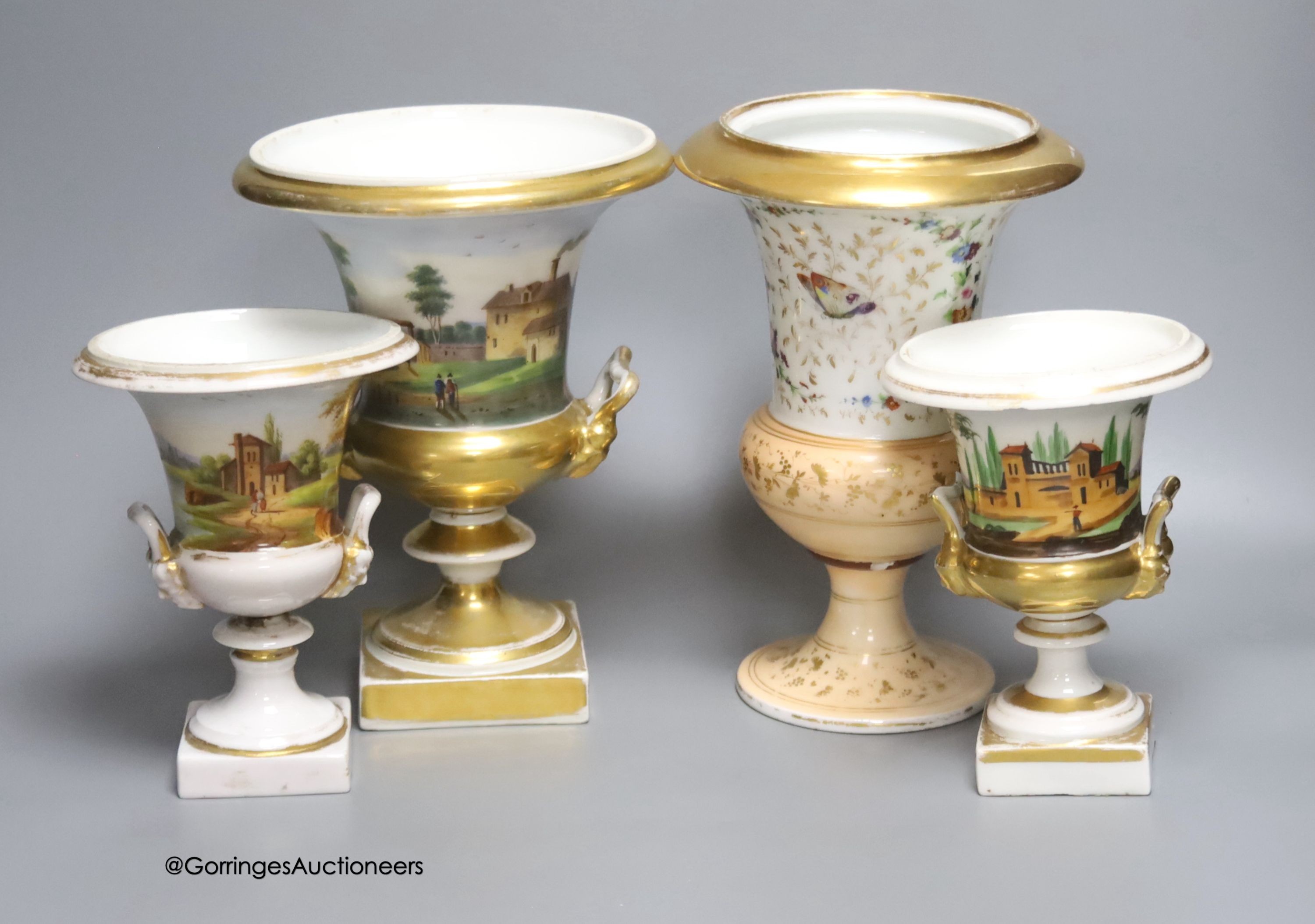 Three Paris porcelain campana urns and another similar vase, height 23cm